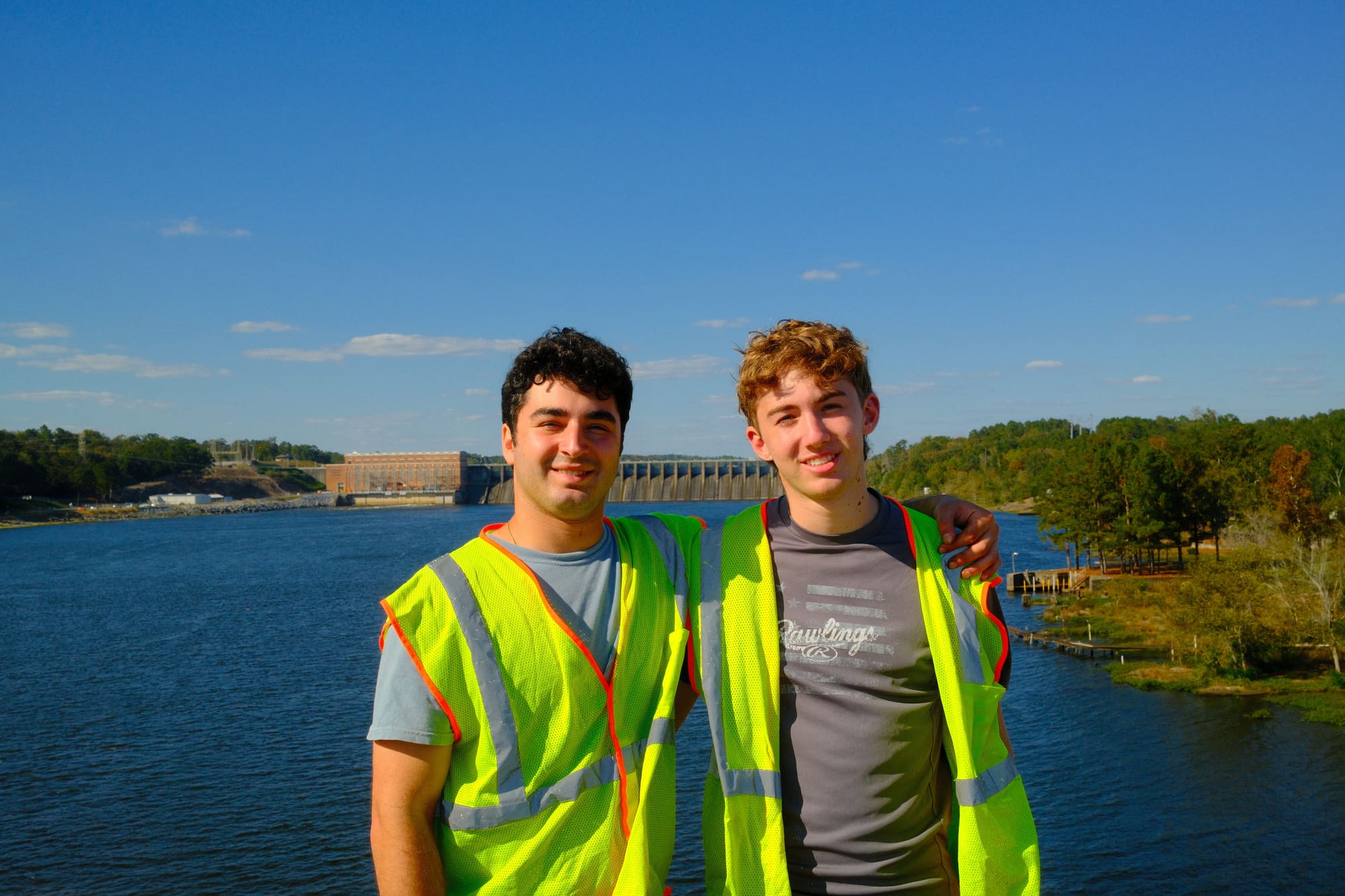 People standing on a dam in rural Alabama